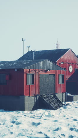 red building in a snowy landscape