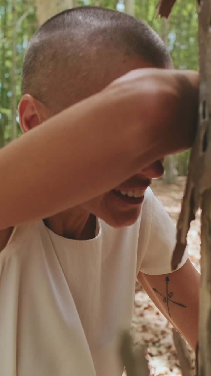 Woman Playing Hide and Seek Game in a Sunny Forest