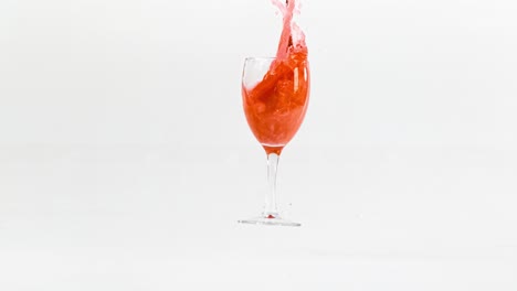 Breaking-the-glass-of-red-wine-in-slow-motion-on-white-background.-Shot-on-super-slow-motion-camera-1000-fps.