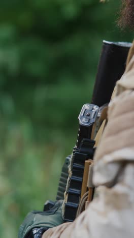 soldier with rifle in a forest