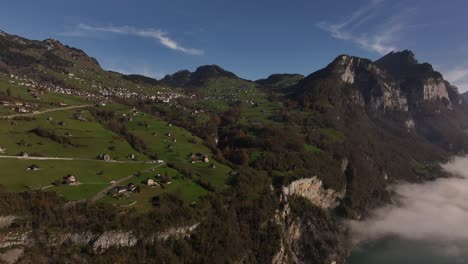 aerial view of amden on a misty morning in the swiss alps, switzerland.