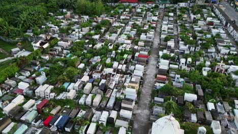 aerial overview of an overgrown catholic cemetery in provincial town of virac, catanduanes during daytime