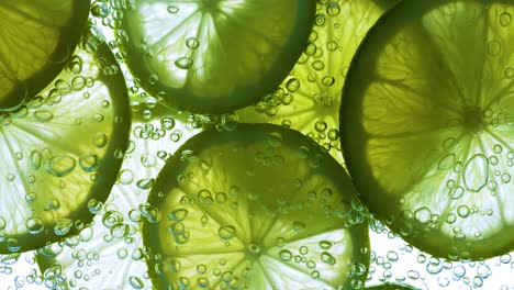 lime slices falling deeply under water. shot on super slow motion camera 1000 fps.