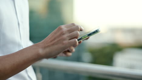 Businessman,-hands-or-phone-typing-on-balcony