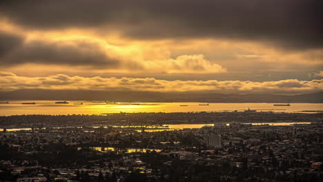 high angle shot over san francisco skyline in california, united states with dark rain clouds passing by during evening time