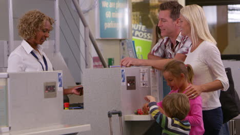 family going on vacation checking in at airport shot on r3d