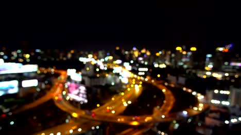 abstract borrón bokeh de las luces de tráfico nocturnas de la ciudad fondo. bangkok tailandia.4k resolución.