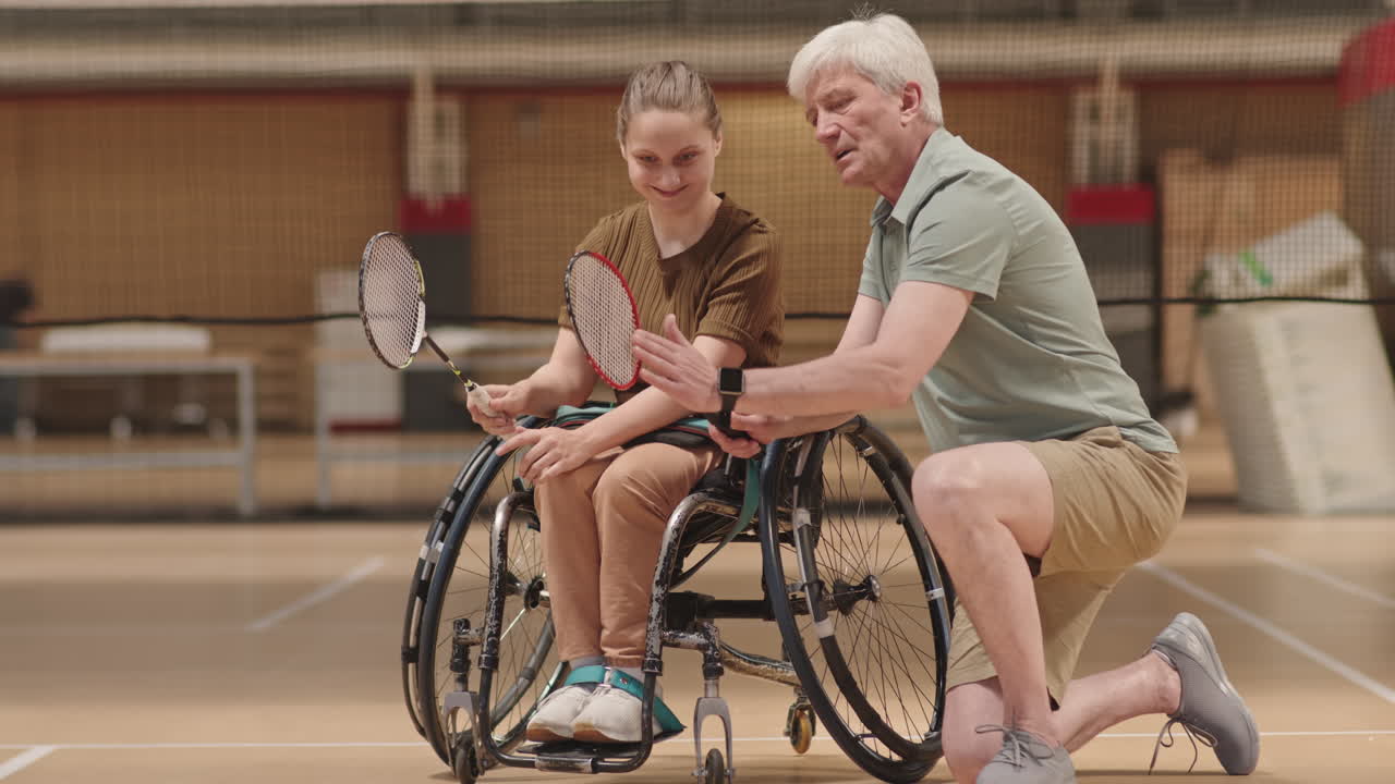 Senior Coach with Girl in Wheelchair
