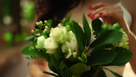 Young-woman-holding-bouquet