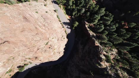 aerial view of winding road through a canyon