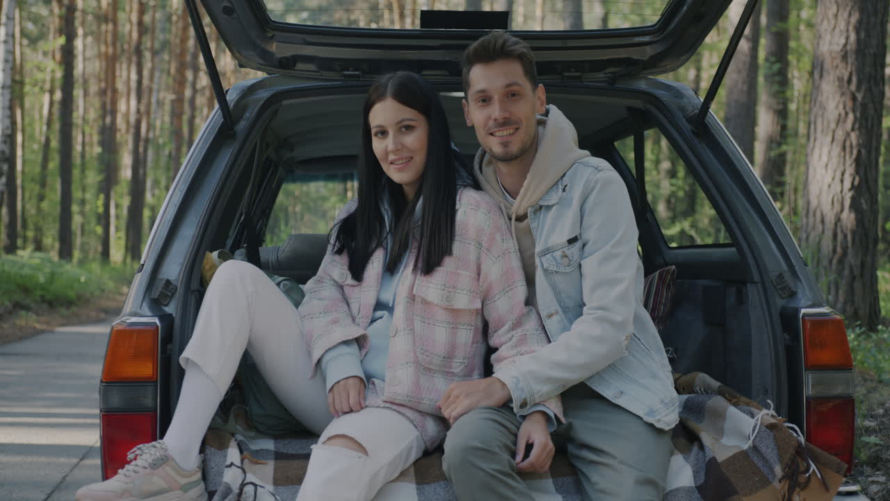 Couple on a road trip in the forest