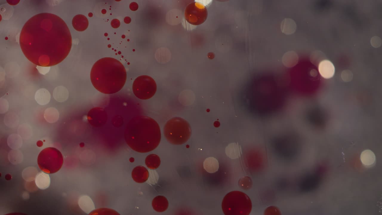 Macro abstract red bubble cells bokeh motion liquid texture background