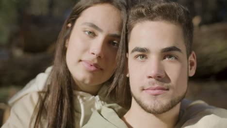 portrait shot of beautiful young couple looking at camera