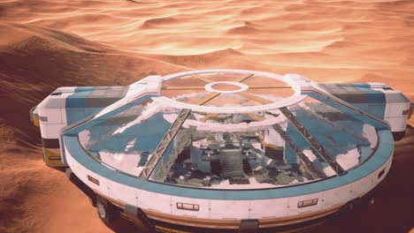edificio de vidrio futurista en las dunas del desierto