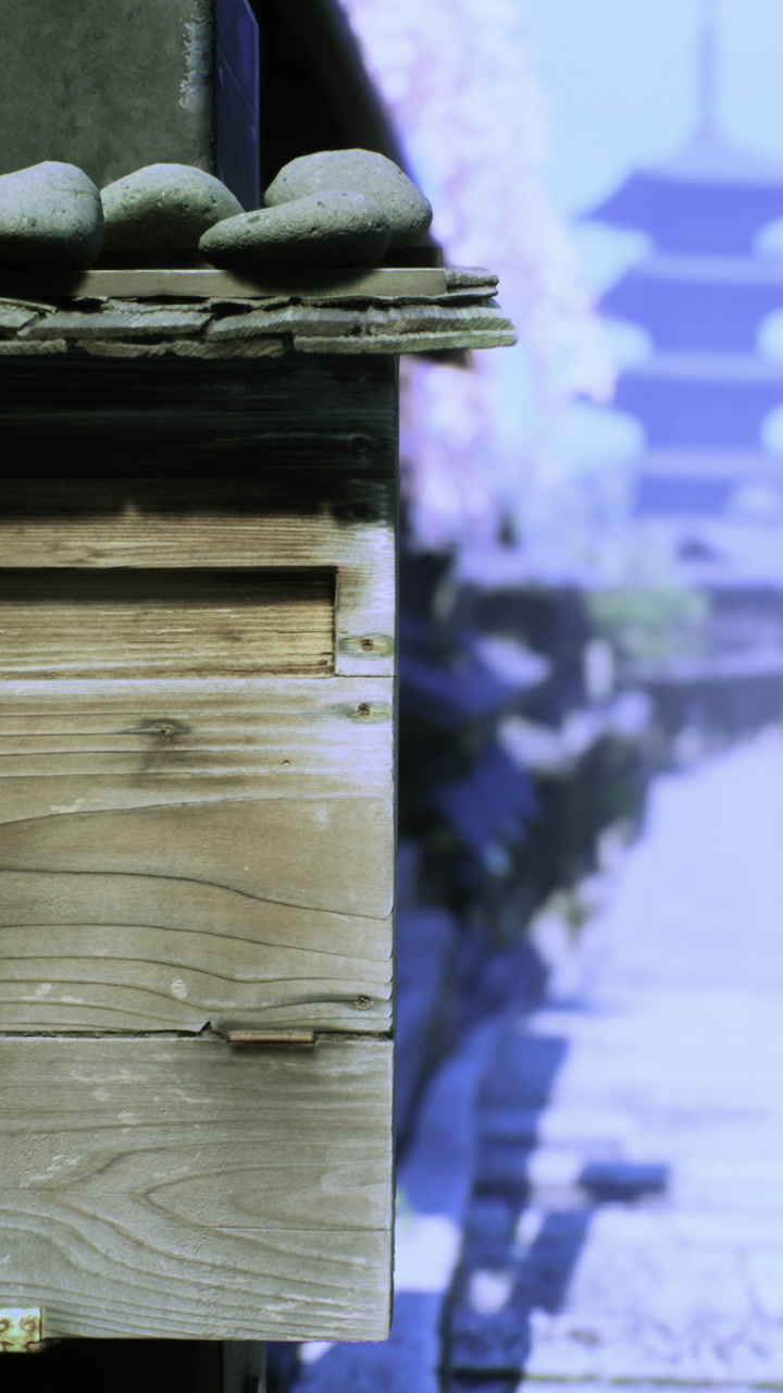 Traditional wooden mailbox stands in a serene japanese street during springtime