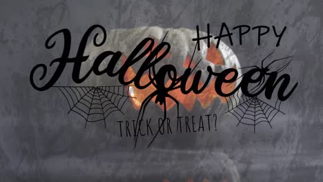 Animation-of-halloween-text-over-carved-pumpkin-with-spiders-on-grey-background