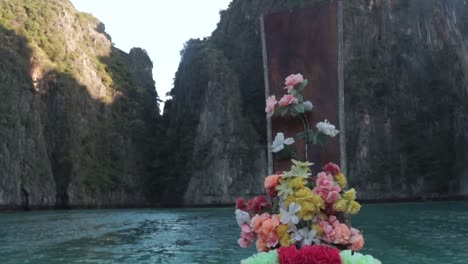 Boat-trip-sightseeing-cliff-islands,-POV-view-from-longtail-boat,-Phi-Phi-Island,-Thailand,-slow-motion