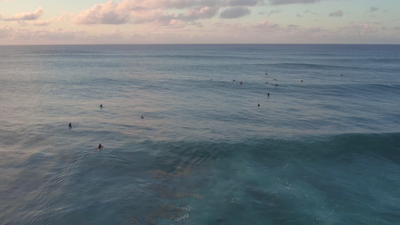 Surfers Surfing At North Shore In Hawaii During Sunset, Aerial Shot