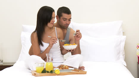 f2_ct_22 couple having nutritious breakfast in bed