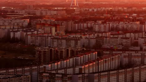 golden hour glows over plavnieki with riga tv tower dominating distant skyline