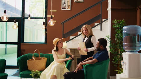 hotel employee welcoming couple