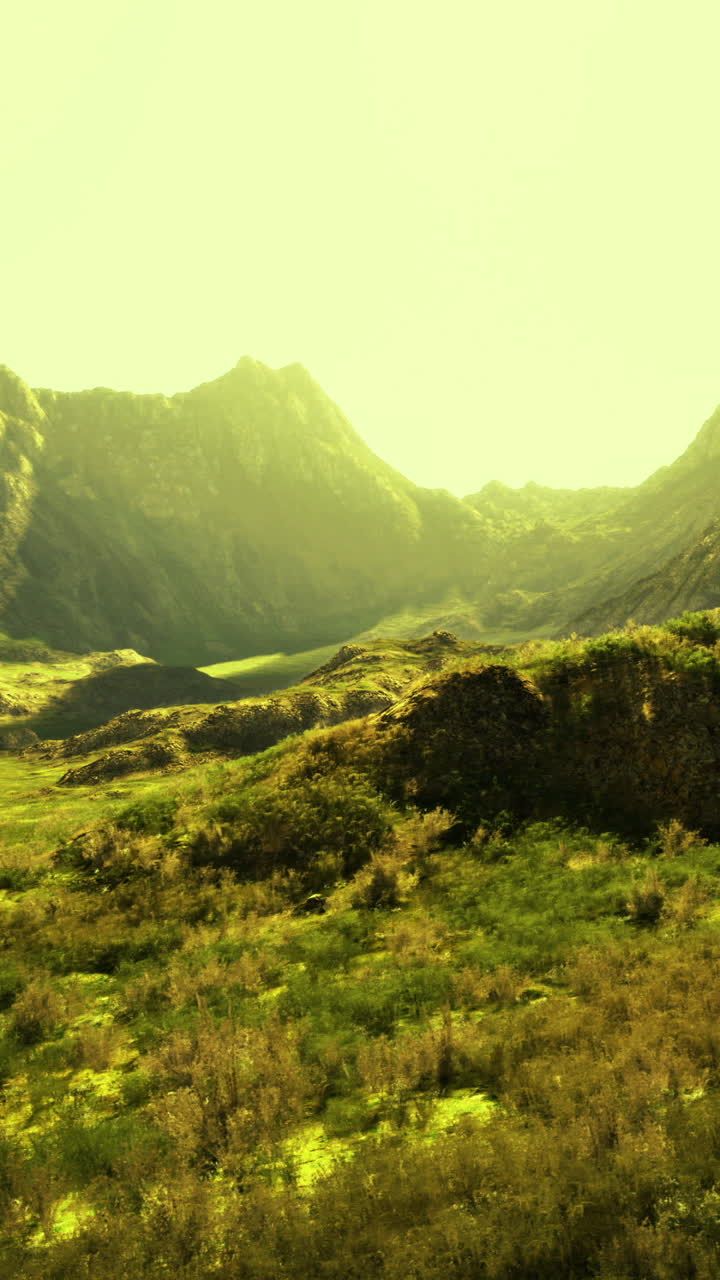 Sunset light casts golden hues over mountain valley landscape in nature