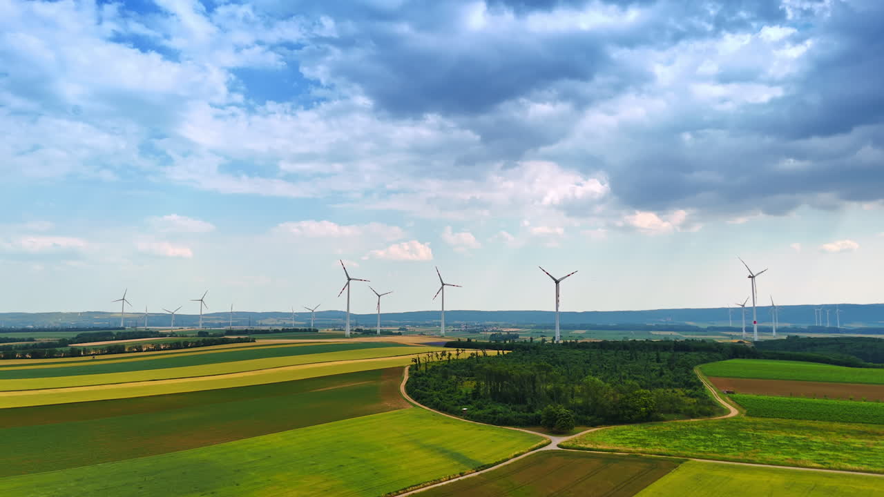 Beautiful nature landscape with numerous wind turbines. Countryside scenery used for sustainable energy production