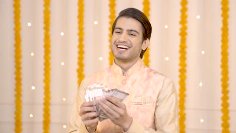 indian man counting money on festival