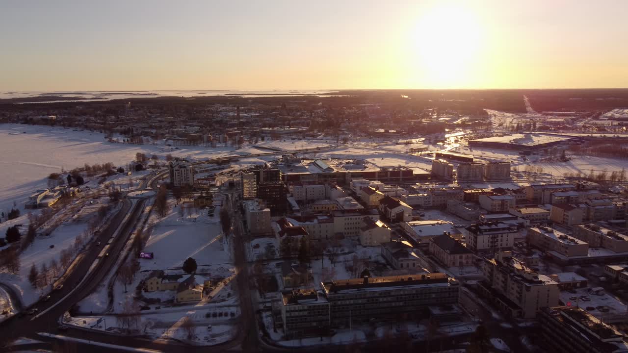 Cityscape Of Tornio At Sunset During Winter In Finland - Drone Pullback