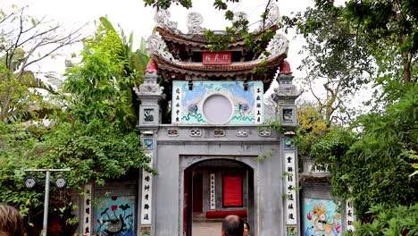 visitors entering a historic temple gate