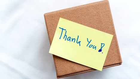 zoom in appreciation thank you gift box home setting close-up warm environment