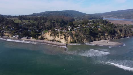 aerial: surfers off bolinas beach in california – 4k