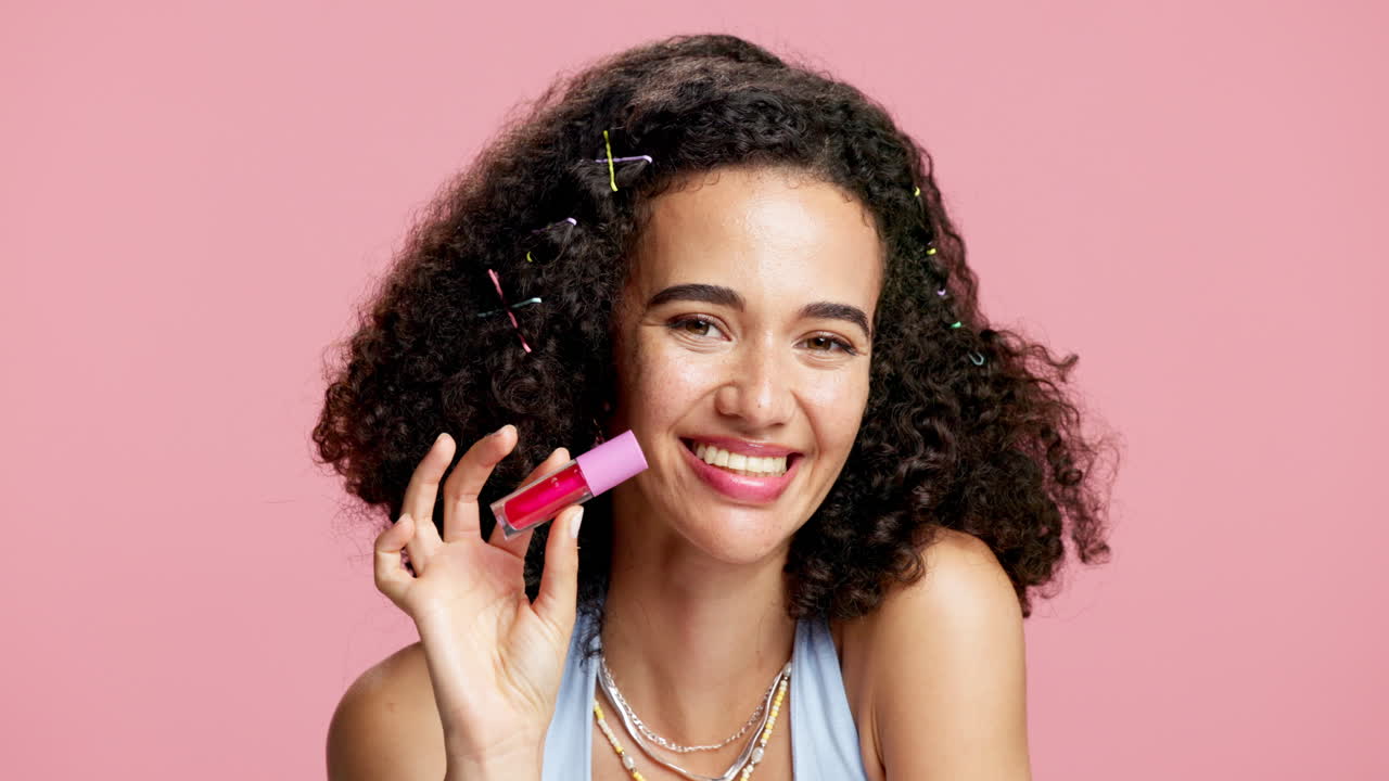 Woman with Curly Hair Holding Lip Gloss