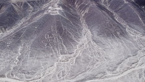 humanoid creatures in nazca, top down aerial view of valley in peru