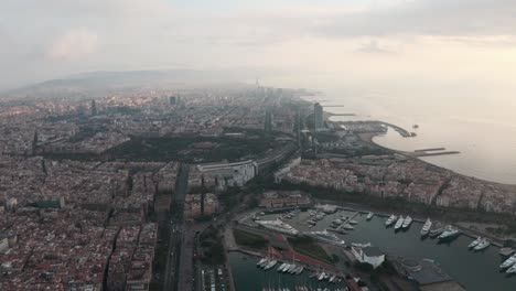 circling drone shot over barcelona port and coast