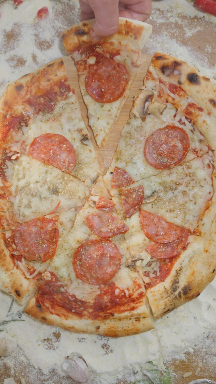 Making pizza with mushrooms, cheese, pepperoni and onion