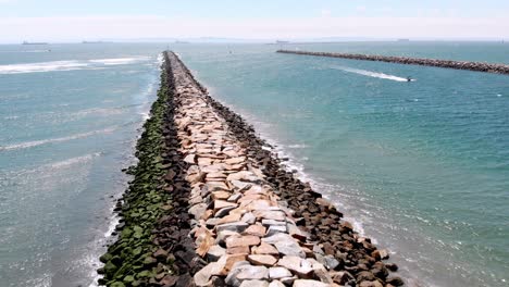 Flight-over-rocky-inlets-with-boat