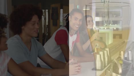 animation of glass with beer over diverse friends having drink in bar