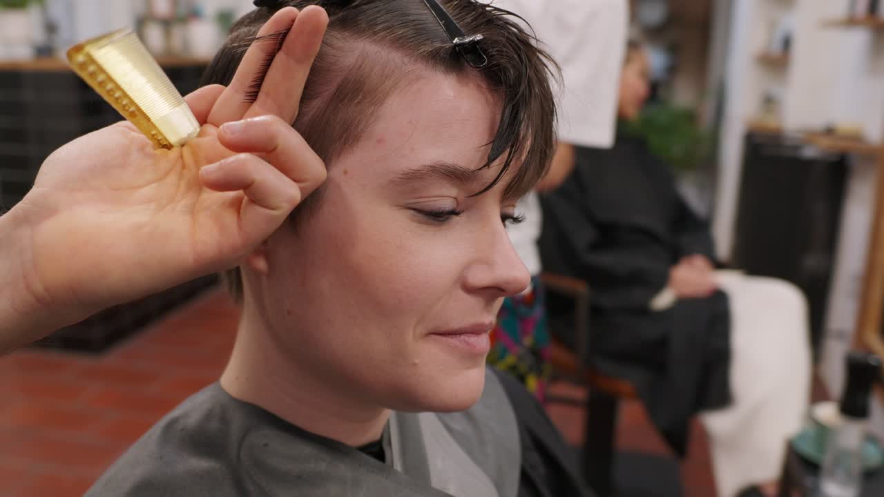 Woman getting a haircut at a hair salon
