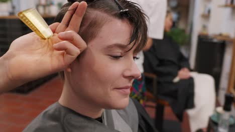 woman getting a haircut at a hair salon