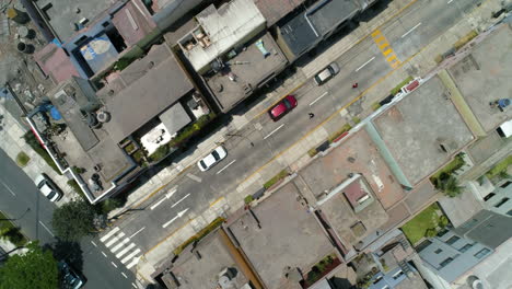 Drone-shot-rotating-over-people-skating-on-the-streets-of-sunny-Lima,-Peru