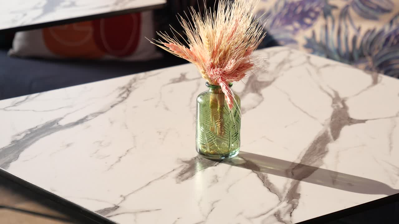 Dried Wheat Arrangement on a Marble Table in a Cafe