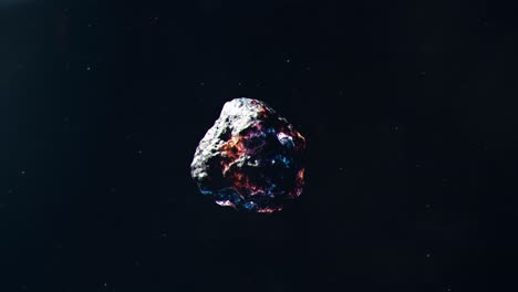 glowing metallic asteroid travelling through space