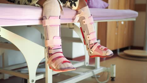 child with leg braces