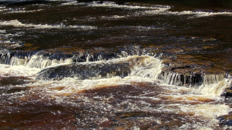shot of the river ure going over rocks at Aysgarth falls, Yorkshire dales