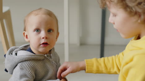 little boys playing with magnetic balls at home