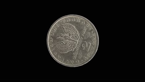 Greece 1967 two drachma coin reverse with phoenix rising from flames design rotating on black background