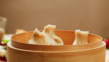steamed khinkali in bamboo steamer