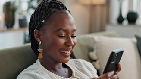 Funny,-smile-and-black-woman-on-a-couch