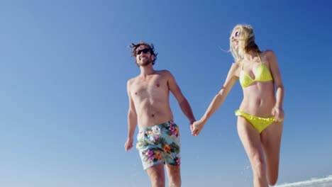 Couple-having-fun-together-at-beach